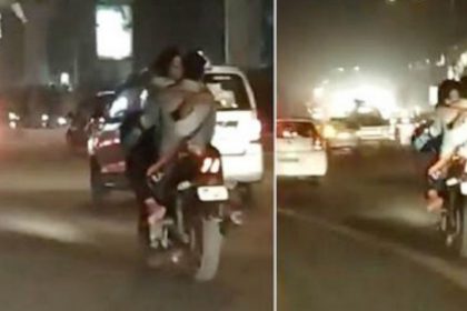 Couple kisses on running bike video viral Delhi